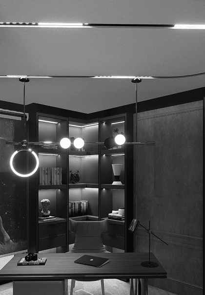 A dark, moody study within an iStudio project: backlit bookshelving, a circular pendant light over a wood desk, and a leather chair against panelled walls.