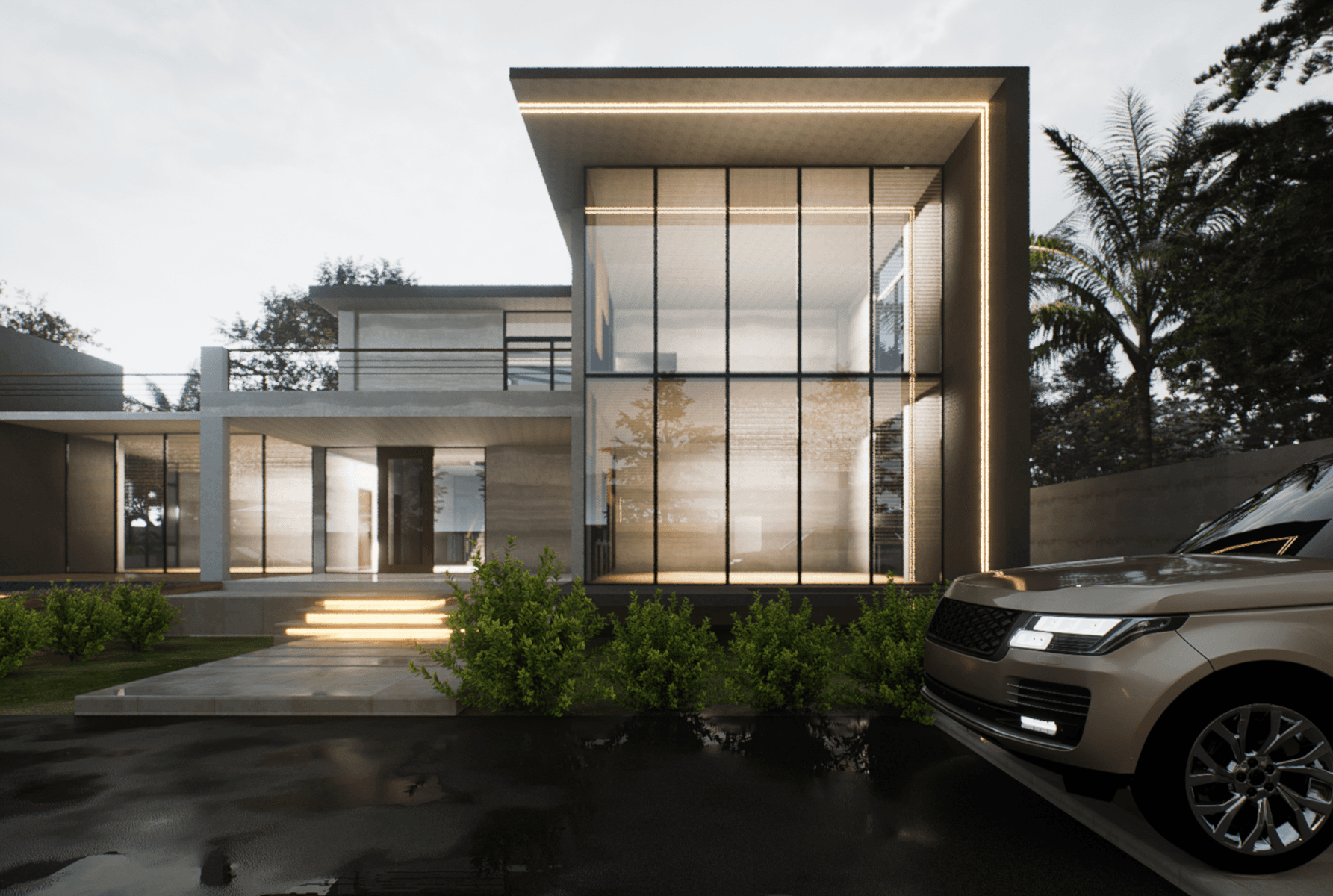 A modern concrete house at dusk with a double-height glazed wing framed by a lit edge, glowing entrance steps and a car on the wet driveway.