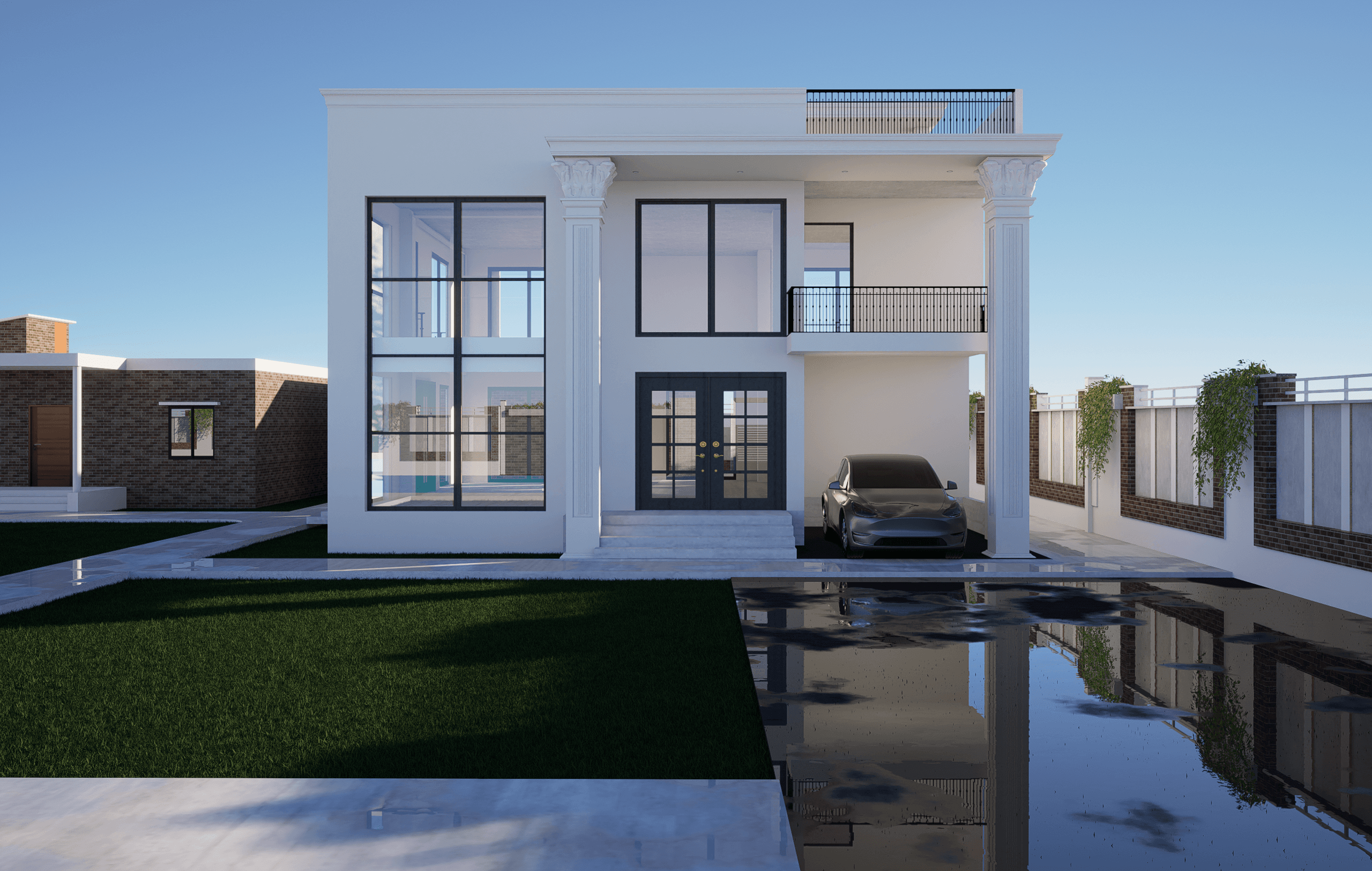 A white two-storey villa with tall black-framed windows, a columned car porch and a lawn beside a reflecting pool.