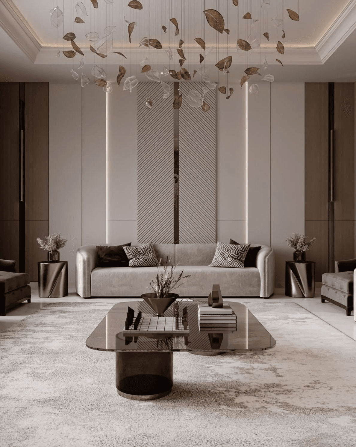 A formal living room: a long low sofa against a panelled wall, a suspended chandelier of scattered glass and metal leaves, and a glass-topped coffee table on a soft-patterned rug.